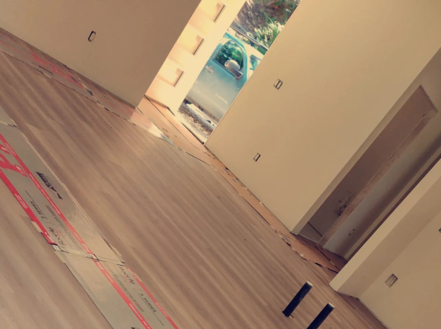 Wood-look plank flooring progressing through an open residential interior