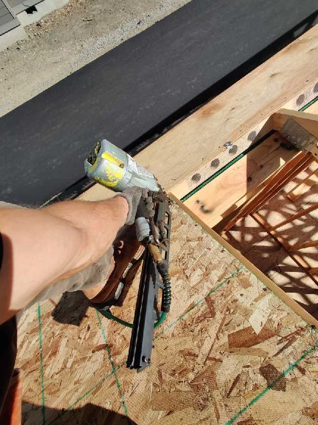 Close-up of wood framing and structural sheathing installation