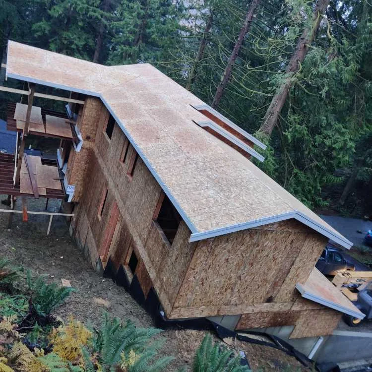 Roof sheathing installed over the framing of my second house