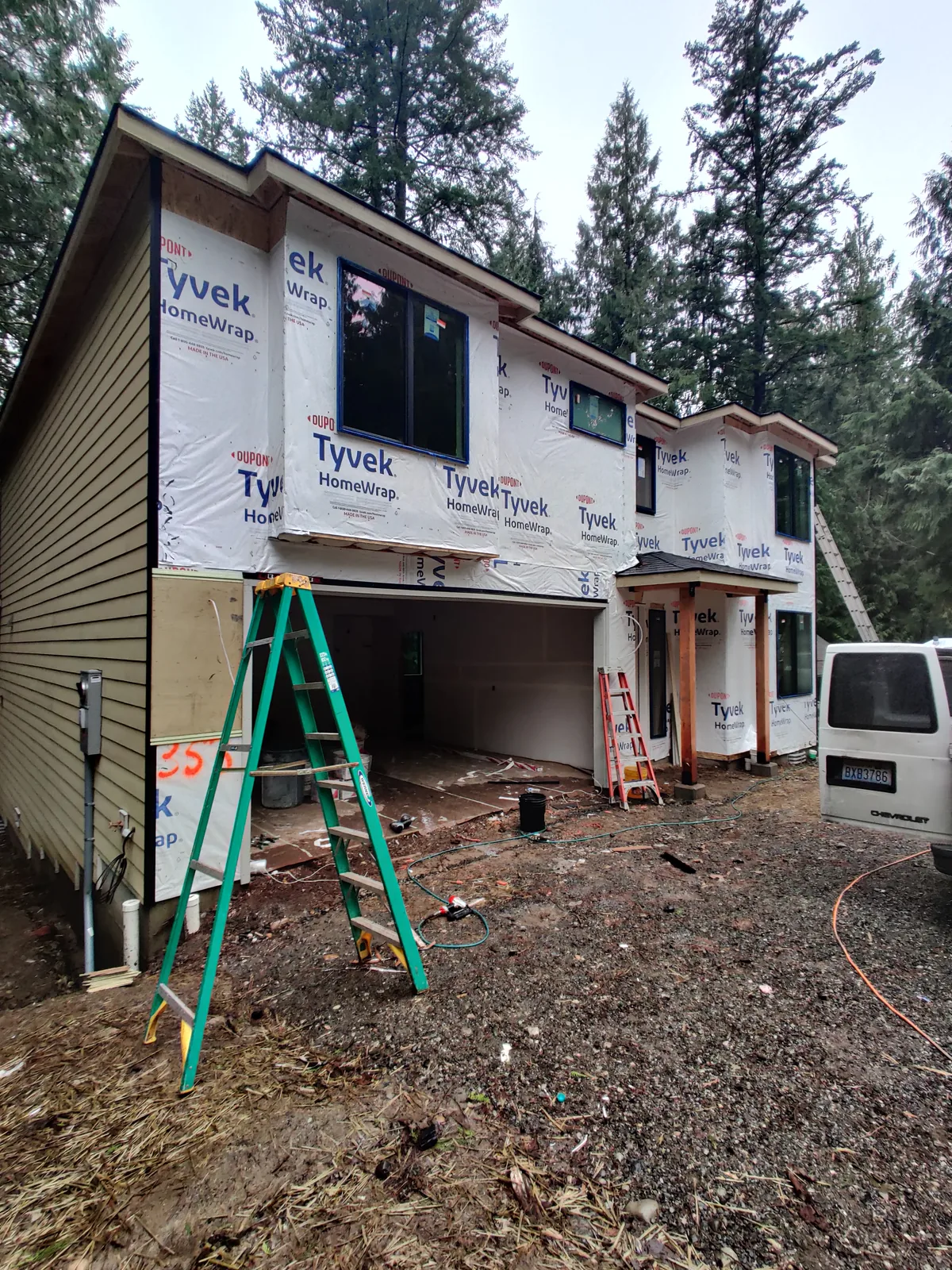 House wrap, flashing, and exterior weather barrier preparation before siding installation